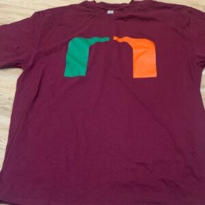 U OF Miami Gildan Burgundy Tee with Green and Orange Design